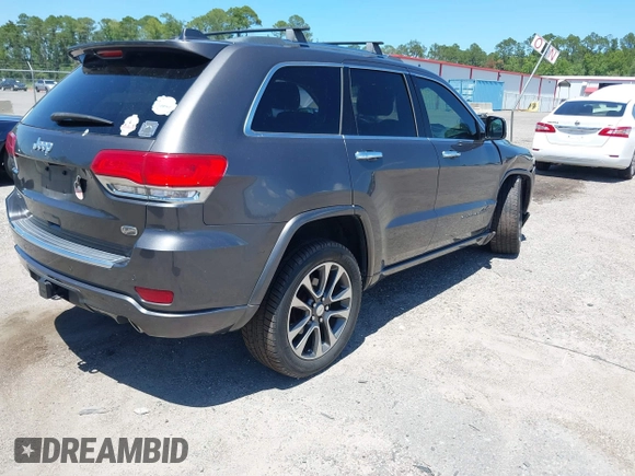 2017 Jeep Grand Cherokee Overland with VIN 1C4RJFCG2HC641791, listed as a IAAI auction lot 42566654 with 116,764 mi miles and . Bid and sale history available at DreamBid. Image 4.