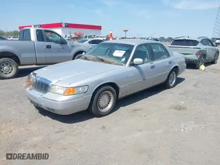 2002 Mercury Grand Marquis LS Premium with VIN 2MEFM75W02X660966, listed as a IAAI auction lot 41869806 with 133,758 mi miles. Bid and sale history available at carsss.com. Image 2.