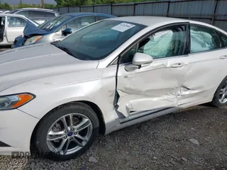2016 Ford Fusion SE Hybrid with VIN 3FA6P0LU7GR356479, listed as a IAAI auction lot 42252046 with 119,046 mi miles and . Bid and sale history available at DreamBid. Image 6.