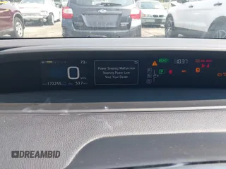 2016 Toyota Prius Four z VIN JTDKARFU1G3027589, wystawiony jako IAAI lot #42391692 z przebiegiem 172 255 mil mil oraz . Historia ofert i sprzedaży dostępna na DreamBid. Obrazek 7.