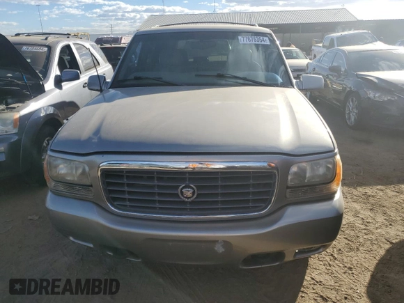 2000 Cadillac Escalade z VIN 1GYEK63R3YR218500, wystawiony jako Copart lot #77676354 z przebiegiem 164 602 mil mil oraz Czysty tytuł • Clean title. Historia ofert i sprzedaży dostępna na DreamBid. Obrazek 5.