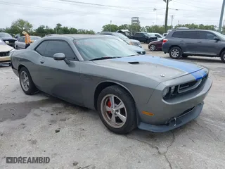 2012 Dodge Challenger SXT with VIN 2C3CDYAG1CH281192, listed as a IAAI auction lot 41756669 with 168,512 mi miles. Bid and sale history available at carsss.com. Image 1.