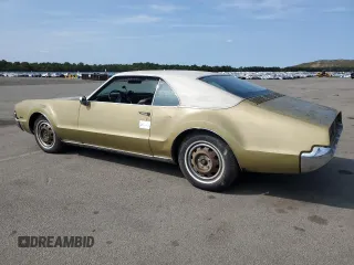 1967 Oldsmobile Toronado with VIN 396877M621130, listed as a Copart auction lot 71016094 with 17,887 mi miles and Salvage Title. Bid and sale history available at DreamBid. Image 2.