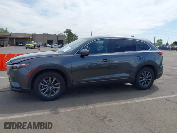 2021 Mazda CX-9 Sport with VIN JM3TCBBY7M0520437, listed as a IAAI auction lot 42022562 with 77,063 mi miles and . Bid and sale history available at DreamBid. Image 14.
