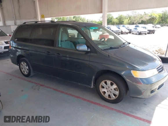 2004 Honda Odyssey EX with VIN 5FNRL18624B056333, listed as a IAAI auction lot 42143860 with 165,687 mi miles and . Bid and sale history available at DreamBid. Image 1.