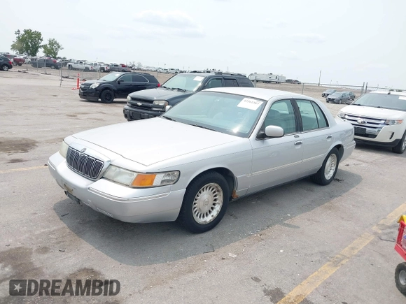 1999 Mercury Grand Marquis LS z VIN 2MEFM75W7XX659031, wystawiony jako IAAI lot #42362387 z przebiegiem 140 067 mil mil oraz . Historia ofert i sprzedaży dostępna na DreamBid. Obrazek 2.