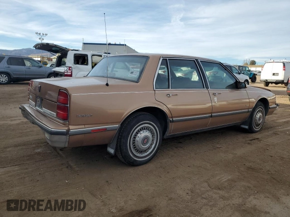 1989 Oldsmobile Delta z VIN 1G3HN54C2KW373577, wystawiony jako Copart lot #41532245 z przebiegiem 78 364 mil mil oraz Tytuł czysty. Historia ofert i sprzedaży dostępna na DreamBid. Obrazek 3.