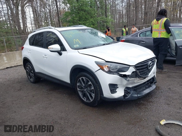 2016 Mazda CX-5 Grand Touring with VIN JM3KE4DY3G0838204, listed as a IAAI auction lot 41961049 with 98,918 mi miles and . Bid and sale history available at carsss.com. Image 1.