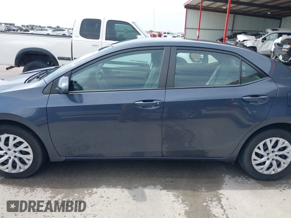 2018 Toyota Corolla L with VIN 5YFBURHE8JP770696, listed as a IAAI auction lot 42386025 with 63,224 mi miles and . Bid and sale history available at DreamBid. Image 14.