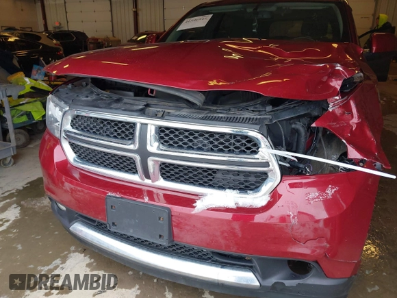 2013 Dodge Durango SXT with VIN 1C4RDJAG4DC527945, listed as a IAAI auction lot 41590545 with 141,074 mi miles and . Bid and sale history available at DreamBid. Image 6.