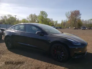 2023 Tesla Model 3 Performance with VIN 5YJ3E1EC1PF577798, listed as a Copart auction lot 55032025 with 20,098 mi miles and Salvage Title. Bid and sale history available at carsss.com. Image 4.