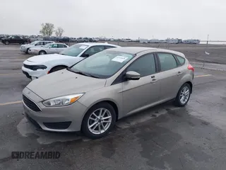 2015 Ford Focus SE with VIN 1FADP3K21FL211511, listed as a IAAI auction lot 42153828 with 126,111 mi miles. Bid and sale history available at carsss.com. Image 2.