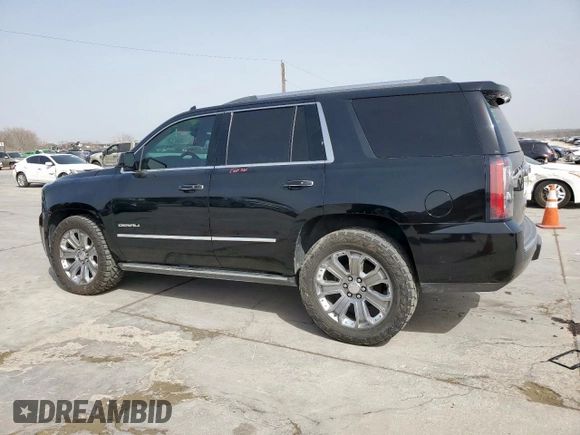 2015 GMC Yukon Denali with VIN 1GKS2CKJ2FR580533, listed as a Copart auction lot 48455205 with 147,532 mi miles and Salvage Title. Bid and sale history available at carsss.com. Image 2.