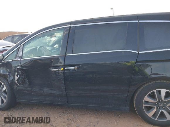 2014 Honda Odyssey Touring with VIN 5FNRL5H90EB077054, listed as a IAAI auction lot 41904456 with 197,869 mi miles and . Bid and sale history available at carsss.com. Image 14.