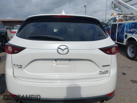 2020 Mazda CX-5 Touring z VIN JM3KFBCM2L0786784, wystawiony jako IAAI lot #42127457 z przebiegiem 62 665 mil mil oraz . Historia ofert i sprzedaży dostępna na DreamBid. Obrazek 16.