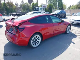 2021 Tesla Model 3 Long Range with VIN 5YJ3E1EB4MF936743, listed as a IAAI auction lot 42154322 with 46,983 mi miles and . Bid and sale history available at DreamBid. Image 4.