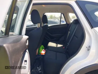 2016 Mazda CX-5 Sport with VIN JM3KE2BY9G0825285, listed as a IAAI auction lot 41841833 with 96,915 mi miles. Bid and sale history available at carsss.com. Image 8.