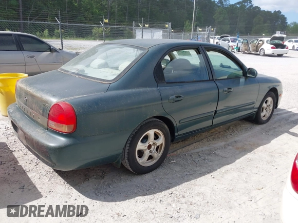1999 Hyundai Sonata GLS with VIN KMHWF35V6XA107973, listed as a IAAI auction lot 42119318 with 174,231 mi miles. Bid and sale history available at carsss.com. Image 4.