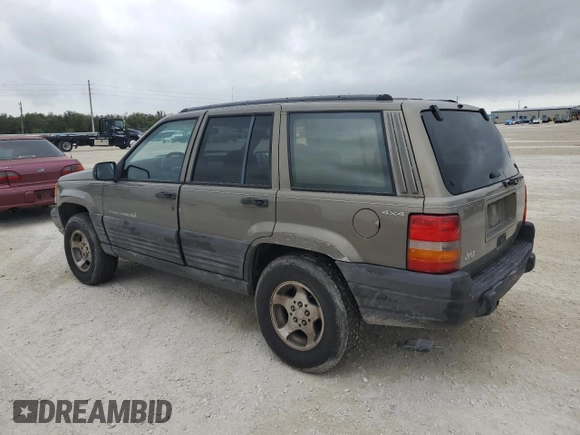 1998 Jeep Grand Cherokee Laredo with VIN 1J4GZ58S6WC137968, listed as a Copart auction lot 84083454 with 0 mi miles and Non Repairable. Bid and sale history available at carsss.com. Image 2.