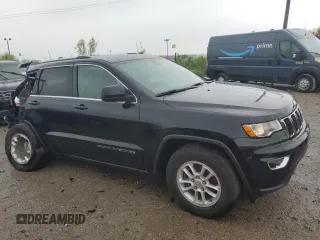 2018 Jeep Grand Cherokee Laredo E with VIN 1C4RJFAG5JC113283, listed as a Copart auction lot 57569595 with 90,897 mi miles and Salvage title. Bid and sale history available at DreamBid. Image 4.