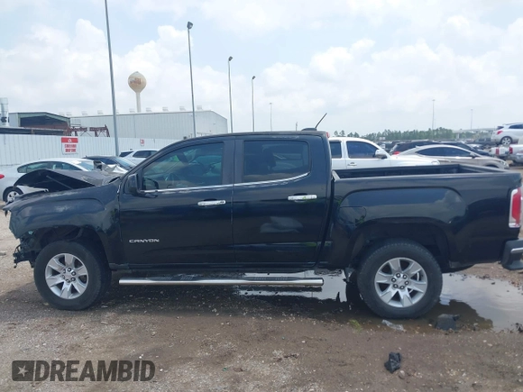 2015 GMC Canyon 2WD SLE with VIN 1GTG5BE3XF1226497, listed as a IAAI auction lot 42106960 with 97,360 mi miles and . Bid and sale history available at DreamBid. Image 15.