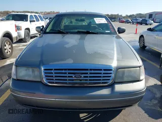 2002 Ford Crown Victoria Police Police Interceptor with VIN 2FAFP71W52X143053, listed as a IAAI auction lot 41594827 with 210,078 mi miles. Bid and sale history available at carsss.com. Image 12.