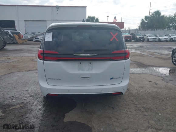 2023 Chrysler Pacifica Hybrid Touring L with VIN 2C4RC1L74PR541551, listed as a IAAI auction lot 42028927 with 57,772 mi miles. Bid and sale history available at carsss.com. Image 16.