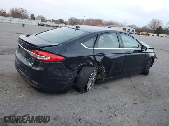 2017 Ford Fusion SE z VIN 3FA6P0HD1HR312200, wystawiony jako Copart lot #82823184 z przebiegiem Nie podano mil oraz Szkoda całkowita • Salvage title. Historia ofert i sprzedaży dostępna na DreamBid. Obrazek 3.