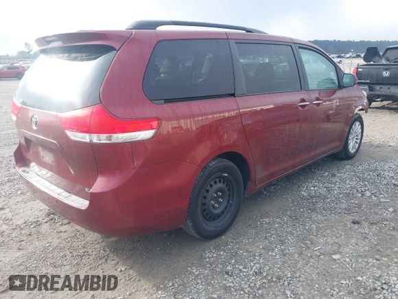 2014 Toyota Sienna XLE with VIN 5TDYK3DCXES471676, listed as a IAAI auction lot 41853038 with 169,790 mi miles. Bid and sale history available at carsss.com. Image 4.
