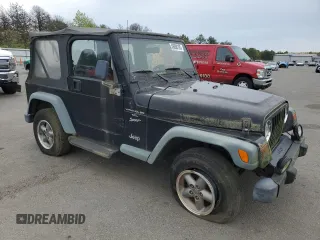 1999 Jeep Wrangler Sport z VIN 1J4FY19S2XP423722, wystawiony jako Copart lot #56098165 z przebiegiem 119 586 mil mil oraz Czysty tytuł • Clean title. Historia ofert i sprzedaży dostępna na DreamBid. Obrazek 4.