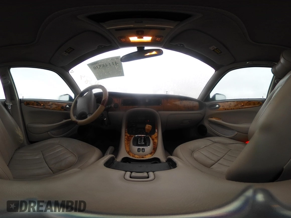 1998 Jaguar XJ with VIN SAJHN1242WC819689, listed as a IAAI auction lot 41148530 with 60,143 mi miles and . Bid and sale history available at DreamBid. Image 18.