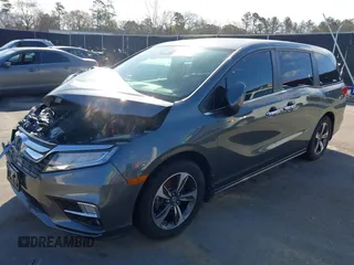 2020 Honda Odyssey Touring z VIN 5FNRL6H8XLB035047, wystawiony jako IAAI lot #41794343 z przebiegiem 57 537 mil mil oraz . Historia ofert i sprzedaży dostępna na DreamBid. Obrazek 2.
