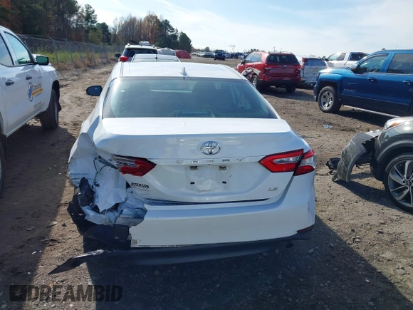2020 Toyota Camry LE with VIN 4T1C11AKXLU986310, listed as a IAAI auction lot 40977100 with 108,208 mi miles and . Bid and sale history available at DreamBid. Image 16.