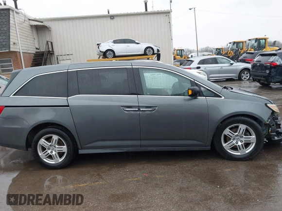 2011 Honda Odyssey Touring Elite with VIN 5FNRL5H9XBB090616, listed as a IAAI auction lot 41944510 with 207,962 mi miles and . Bid and sale history available at DreamBid. Image 14.