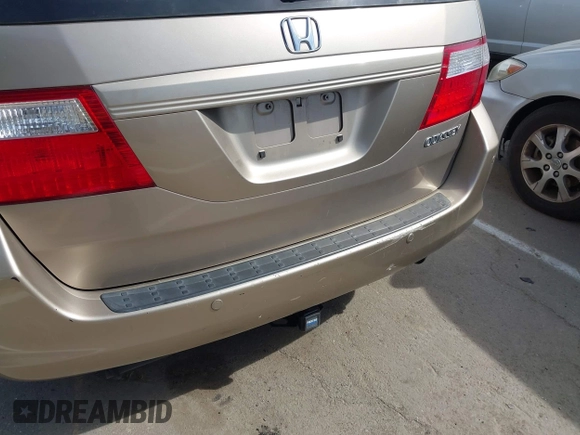 2005 Honda Odyssey EX-L z VIN 5FNRL38615B407908, wystawiony jako IAAI lot #42076045 z przebiegiem 170 950 mil mil oraz . Historia ofert i sprzedaży dostępna na DreamBid. Obrazek 14.