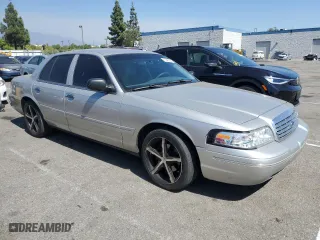 2004 Ford Crown Victoria LX with VIN 2FAFP74W44X184918, listed as a Copart auction lot 73346744 with 157,925 mi miles and Salvage Title. Bid and sale history available at carsss.com. Image 4.