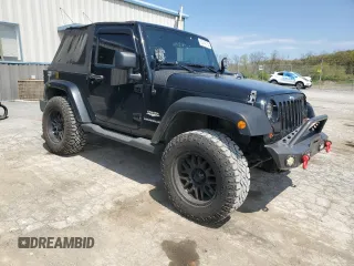 2011 Jeep Wrangler Sahara with VIN 1J4AA5D14BL542912, listed as a Copart auction lot 65158784 with 122,795 mi miles and Salvage Title. Bid and sale history available at DreamBid. Image 4.