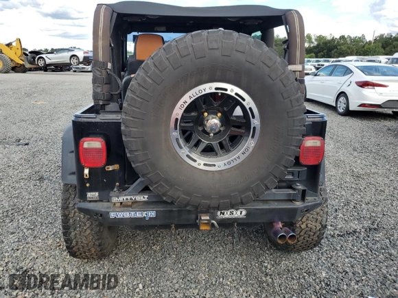 2004 Jeep Wrangler Rubicon with VIN 1J4FA69S54P769356, listed as a Copart auction lot 74089914 with 0 mi miles and Salvage Title. Bid and sale history available at carsss.com. Image 6.