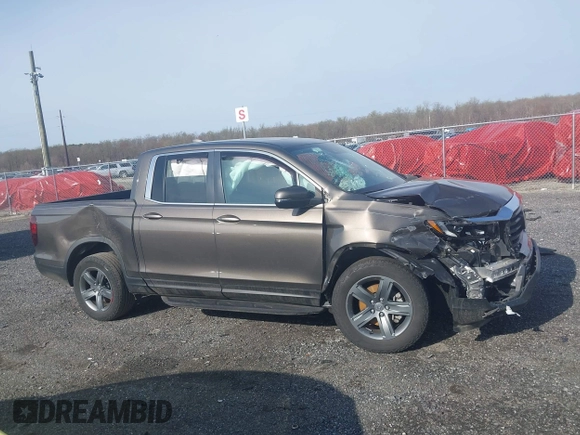 2022 Honda Ridgeline RTL z VIN 5FPYK3F51NB038239, wystawiony jako IAAI lot #41937070 z przebiegiem 39 012 mil mil oraz . Historia ofert i sprzedaży dostępna na DreamBid. Obrazek 13.