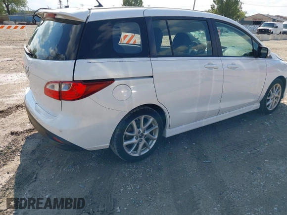 2013 Mazda 5 Touring with VIN JM1CW2CLXD0151396, listed as a IAAI auction lot 40479013 with 118,314 mi miles and . Bid and sale history available at DreamBid. Image 4.