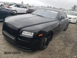 2014 Rolls-Royce Wraith z VIN SCA665C5XEUX84336, wystawiony jako Copart lot #73181343 z przebiegiem 34 367 mil mil oraz Szkody całkowita. Historia ofert i sprzedaży dostępna na DreamBid. Obrazek 1.