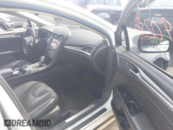 2016 Ford Fusion Titanium with VIN 3FA6P0K99GR317034, listed as a IAAI auction lot 42590288 with 200,468 mi miles and . Bid and sale history available at DreamBid. Image 5.