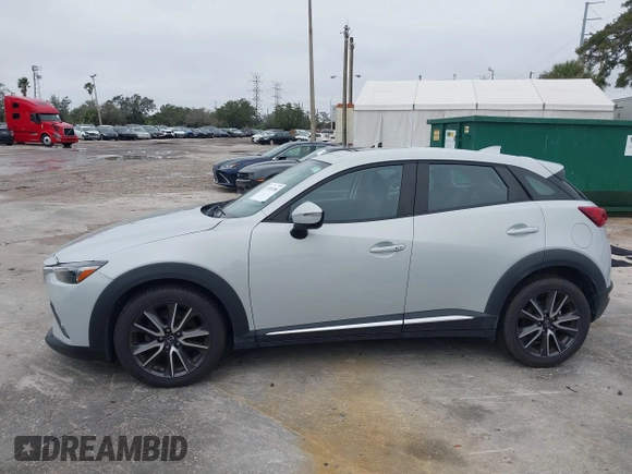 2016 Mazda CX-3 Grand Touring with VIN JM1DKDD72G0128891, listed as a IAAI auction lot 41401456 with 60,911 mi miles. Bid and sale history available at carsss.com. Image 14.