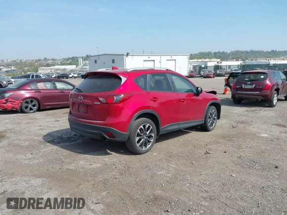 2016 Mazda CX-5 Grand Touring with VIN JM3KE4DY9G0850583, listed as a IAAI auction lot 42075545 with 92,789 mi miles and . Bid and sale history available at carsss.com. Image 4.