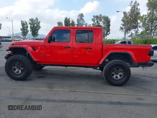 2021 Jeep Gladiator Rubicon with VIN 1C6JJTBGXML572976, listed as a IAAI auction lot 42134909 with 35,612 mi miles and . Bid and sale history available at DreamBid. Image 14.