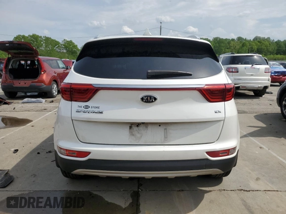 2019 Kia Sportage EX z VIN KNDPNCAC7K7522953, wystawiony jako Copart lot #54906835 z przebiegiem 128 011 mil mil oraz Szkoda całkowita • Salvage title. Historia ofert i sprzedaży dostępna na DreamBid. Obrazek 6.