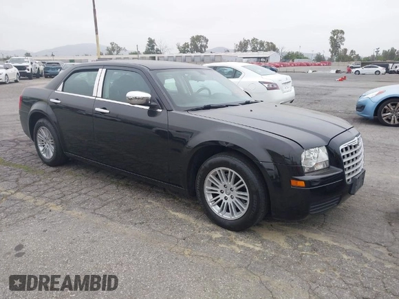 2009 Chrysler 300 LX with VIN 2C3KA43D19H506753, listed as a IAAI auction lot 42053199 with 106,092 mi miles. Bid and sale history available at carsss.com. Image 1.