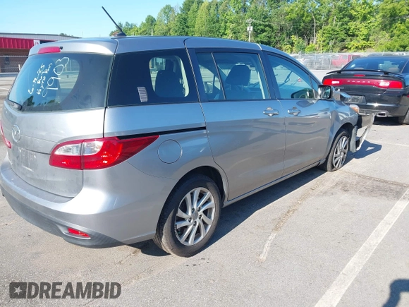 2012 Mazda 5 Sport with VIN JM1CW2BLXC0129303, listed as a IAAI auction lot 42556899 with 200,863 mi miles and . Bid and sale history available at DreamBid. Image 4.