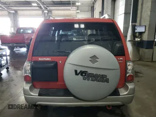 2004 Suzuki Grand Vitara LX z VIN JS3TD62V444101460, wystawiony jako Copart lot #70063234 z przebiegiem 113 618 mil mil oraz Szkoda całkowita • Salvage title. Historia ofert i sprzedaży dostępna na DreamBid. Obrazek 6.