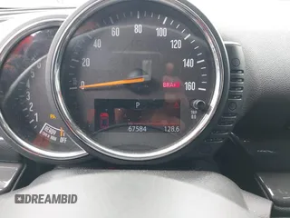 2016 MINI Clubman z VIN WMWLN5C56G2E30309, wystawiony jako IAAI lot #41772501 z przebiegiem 67 584 mil mil oraz . Historia ofert i sprzedaży dostępna na DreamBid. Obrazek 12.